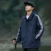 Chamarra transfronteriza de tres franjas para hombre, estilo primavera y otoño, cortavientos para deportes al aire libre, chamarra casual con capucha para correr, chamarra impermeable a prueba de viento