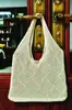 Bolso de Mano Cruzado Bolso Tote para Mujer Japonés y Coreano Color Sólido Retro Bolso de Punto Hueco Bolso Tejido Bolso de Venta al por Mayor Transfronterizo