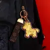 Hazte Rico al Instante Llavero de Caballo Dorado Souvenir Regalo para Empresas para Dar a los Clientes como un Pequeño Detalle para Atraer Clientes
