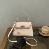 Bolso Pequeño Cuadrado de Mano Bolso de Hombro Único Bolso Cruzado para Ir al Trabajo Hebilla de Cierre Bolso de Moda para Mujer 2026 Otoño Nuevo Estilo Coreano Bolso Sencillo para Mujer