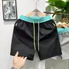 Pantalones cortos de secado rápido para hombre en verano, marca deportiva de moda, pantalones finos de tres cuartos con bolsillo con cremallera, pantalones cortos de playa de color liso para correr y uso al aire libre