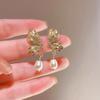 Pendientes de perlas con alas de mariposa microincrustadas de estilo francés para mujer, diseño de lujo, ligeros y de estilo avanzado, pendientes retro al por mayor.