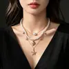 Collar transfronterizo de estilo oceánico de doble capa europeo y americano para mujer, con estrellas de mar, conchas y perlas, adecuado para vacaciones