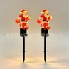 Nuevas luces solares de Navidad para decoración de ambiente, luces de suelo brillantes de Papá Noel, luces para césped de patio exterior