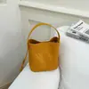 Bolso de Cubo Tejido Versátil Retro de Nicho Moda Francesa 2026 Nuevo Bolso de Hombro Cruzado Simple de Gama Alta
