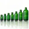 Botellas dispensadoras de aceite esencial verdes en stock 30 ml 15 ml Modelos más vendidos Botellas gotero tipo pulsador 50 ml 10 ml Botellas para suero