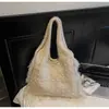 Bolsa de Lã Tricotada Estilo Relaxado de Ombro Único para Mulheres 2026 Novo Modelo Bolsa Tote de Viagem Simples de Grande Capacidade