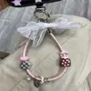 Llavero corto de cuero PU con forma de lazo nuevo, único y elegante, accesorio para bolso al por mayor