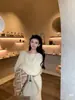 Elegante y sofisticado conjunto de una pieza asimétrico de lana con textura suave