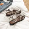 Sandalias para Mujer, Nuevo Estilo de Verano, Sandalias Romanas Planas, Sandalias Casuales Tejidas de Una Correa con Hebilla y Punta Cerrada para Mujer al por Mayor