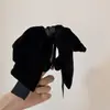 Pinza de coleta de terciopelo negro de alta gama con lazo de purpurina fina, elegante y a la moda, pinza banana para coleta semi-recogida, accesorio para el cabello para mujer