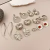 Pendientes Redondos Geométricos de Flor de Aguja Plateada Transfronterizos Europeos y Americanos Pendientes de Nicho de Gama Alta Pendientes de Moda Estilo Simple Minimalista