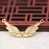 Yiwu Chapado en Oro Cobre Conservador de Color Ala Pequeña Zircón Micro-Incrustado Doble Agujero Ángel Collar Accesorio B1282-B