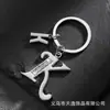 Llavero de estrella hueca con letra para comercio electrónico transfronterizo, llavero personalizado con letra nueva para hombre, accesorios