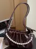 Bolso de Axila Plegado de Nicho Estilo Coreano para Mujer Moda Otoño 2025 Estilo Cadena de Perlas Bolso de Hombro Cruzado para Viajar