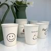 Taza desechable estilo ins engrosada comercial patrón de dibujos animados taza de papel para el hogar taza de leche de soja cara sonriente taza de agua al por mayor