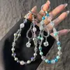 Elegante correa de cristal con cuentas para teléfono con colgante de girasol de circonita, cordón para teléfono, accesorio para muñeca y bolso, anti-pérdida