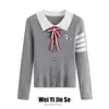 Cárdigan de punto ajustado con cuello polo y pajarita blanca de contraste, estilo universitario primavera 2026, top extremadamente elegante para mujer