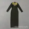 Nuevo vestido transfronterizo estilo europeo y americano, sensación de lujo ligero y alta gama, adornado con diamantes, huecos, de manga larga, ajustado, vestido de vendaje, vestido de noche, vestido largo