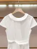 Shenzhen Nanyou alta costura feminina nova coleção de verão estilo casual elegante vestido branco de manga curta que afina a cintura