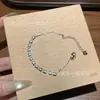 Venta al por mayor del fabricante pulsera de jadeíta azul natural Xiaohongshu con incrustaciones de plata s925, diseño moderno y versátil para mujer