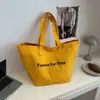 Bolso de lona para mujer de gran capacidad 2026, bolso tote de caramelo para dama, bolso de hombro urbano simple de moda para el día a día