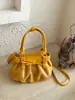 Nuevo bolso de moda de nicho con pliegues en la axila para mujer, bolso de hombro vintage de alta gama para el día a día, bolso de mano popular