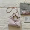 Bolsa de Mão Doce com Bolinhas Estilo Coreano Transfronteiriça para Mulheres 2026 Novo Modelo de Verão Bolsa de Ombro/Axila com Laço Design de Nicho