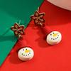 Pendientes Serie Navideña 2024 Femeninos Europeos y Americanos Más Vendidos Papá Noel Muñeco de Nieve Lazo Goteo de Aceite Pendientes de Pin Plateado Pendientes
