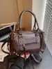 Bolsos transfronterizos 2026 otoño e invierno estilo motero vintage de gran capacidad bolso de mano bolso tote pequeño bolso cruzado de alta gama