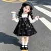 Conjunto de duas peças de saia xadrez de outono para meninas, importado, novo, estiloso, vestido de pequena princesa, atacado de roupas infantis