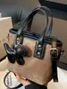 Bolsos de Nicho de Estilo Occidental de Moda 2026 Primavera Nuevo Bolso de Hombro Cruzado Vintage Bolso de Mano de Moda Bolso Cubo para Mujer