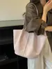 Bolso cubo tejido súper popular para mujer, nuevo modelo de verano 2026, de alta gama, lujo ligero, nicho, versátil para el trabajo, bolso de hombro