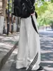 Pantalones largos de marca de moda estilo americano de corte holgado, pantalones deportivos casuales de pierna ancha, pantalones de chándal a rayas de alta resistencia para hombre, diseño deconstruido de otoño