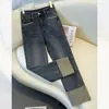 Calça jeans feminina de tubo de fumaça primavera e outono 2024, nova, popular deste ano, explosões, calças baguete, pequenas nove calças retas