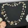 Nova Versão de Alta Qualidade Transfronteiriça de Colar Longo de Pérolas Estilo Chanel com Etiqueta, Corrente de Suéter Chanel de Luxo Leve para Mulheres Atacado