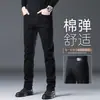 Pantalones de mezclilla negros y grises de alta gama para primavera, nuevos pantalones rectos ajustados para hombre, pantalones largos cálidos y casuales para hombre