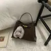 Bolso Pequeño Retro de Alta Gama Transfronterizo Otoño e Invierno para Mujer 2026 Nueva Moda Versátil Bolso Cruzado Bolso de Mano Bolso Cubo