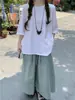 Fotos Reales de la Nueva Colección Primavera 2026: Camiseta Blanca + Falda con Tirantes a Cuadros + Pantalones Anchos Cropped