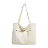 Bolsa tote de lona lavada estilo japonês transfronteiriça, grande capacidade, design simples, adequada para o trajeto diário, e pode ser usada como bolsa de compras para estudantes