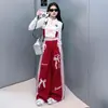 Nueva colección de primavera y otoño para niñas 2026: un conjunto de dos piezas con un top de corbata de moño y pantalones de pierna ancha en un estilo retro americano de street dance, diseñado para ventas transfronterizas