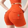 Nuevos shorts de yoga estilo ropa de trabajo transfronteriza con diseño de trasero en forma de durazno, cintura alta, tela elástica, efecto levanta glúteos, cierre de botón y material de secado rápido; hecho a medida