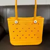 Atacado em estoque Bolsa de praia moldada por injeção de EVA Bolsa cesta de EVA com furos Popular na Europa e América Praia Portátil Cesta de praia