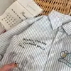 Camisa de Manga Comprida Infantil 2026 Nova Primavera Gola Cartoon Top para Meninos e Meninas, Camisa Listrada Vertical para Crianças Pequenas