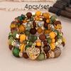 Pulsera de borlas con colgante de amor hueco multicapa de estilo bohemio de venta caliente europeo y americano, juego de joyería multicapa con cuentas de vidrio