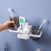 Estante dental de baño sin perforaciones plegable creativo montado en la pared ventosa vaso para enjuague bucal fábrica directa soporte de pared con ventosa