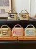 Bolso cubo de moda bordado nuevo para mujer transfronterizo, bolso tote tejido de paja y bambú, bolso cruzado para la playa y la costa