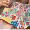 Top de tirantes floral Dopamine Verano Holgado Vacaciones en la playa Hello Kitty Dibujos animados de alto valor Lindo Conjunto de dos piezas