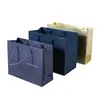 Bolsas de mano de cartulina blanca de alta gama con impresión de logotipo personalizado, bolsas para regalos empresariales de exposiciones, bolsas de papel engrosado con impresión personalizada