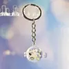 Nuevo Colgante Creativo de Bolsa con Cara Sonriente de Pulpo Brillante Dibujo Animado Pequeño Regalo Llavero de Moda Anillo de Llave